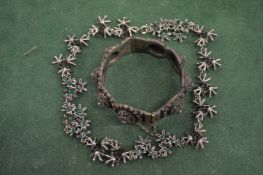 A bangle and a necklace.