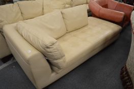 A Roche Bobois cream leather chaise longue.
