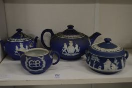 A Wedgwood blue Jasper ware Royal Commemorative three piece tea service and a similar bowl and