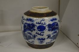 A Chinese blue and white dragon jar.