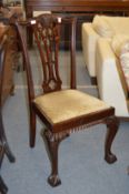 A set of four Georgian style mahogany dining chairs.