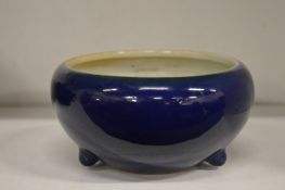 A Chinese blue glazed circular bowl.