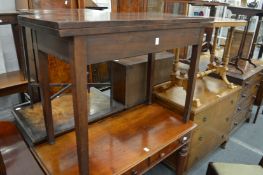 A 19th century mahogany rectangular foldover tea table.