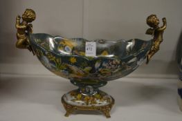 A French style porcelain and ormolu twin-handled oval pedestal bowl.