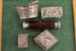 A small group of silver items and a double ended scent bottle.