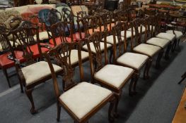 A set of twelve Chippendale style mahogany dining chairs, two with arms.