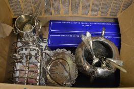 A box of plated wares.