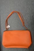 A ladies' orange handbag.