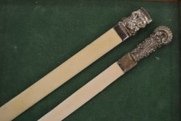 Two silver handled ivory letter openers.