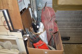 A quantity of golf clubs and accessories.