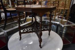 A Victorian walnut octagonal shaped centre table.