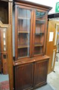 A Victorian mahogany cupboard bookcase.