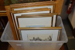A box of paintings and prints.