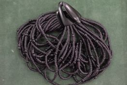 A Gerda Lynggaard horn necklace with bag.