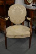 A Hepplewhite style upholstered mahogany framed armchair.