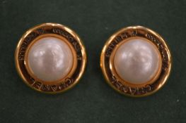 A pair of gilt and pearl ear clips.