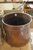 A copper coal bucket.