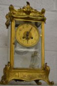 An ormolu four glass mantle clock with mercury pendulum.