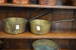 Two brass cooking pans.