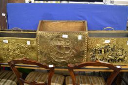 Three embossed brass magazine racks.