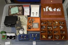 A collection of cufflinks and other gentlemen's accessories.