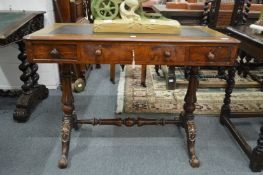 A Victorian walnut three drawer stretcher table.
