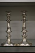 A pair of plated candlesticks.