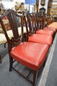 A set of four mahogany shield back dining chairs.