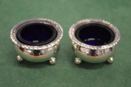 A pair of silver salts.