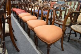 A set of four Victorian walnut dining chairs.