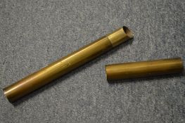 A brass tube or canister, possibly for holding documents.
