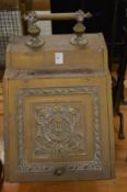 A Victorian embossed brass coal box.