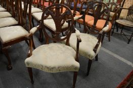 A pair of Hepplewhite style mahogany open armchairs, the oval backs with carved Prince of Wales