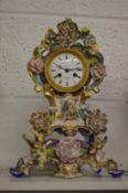 A French porcelain mantle clock on matching stand.
