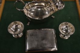 A silver cigarette case and other items.
