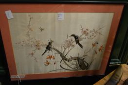 A Chinese silk embroidered picture of birds on a branch.