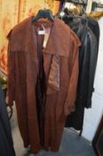 A ladies' plum coloured leather full length coat.