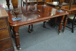 A good mahogany extending dining table with one extra leaf.