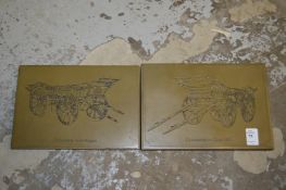 A pair of decorative plaques.