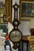 A rosewood cased wheel barometer / thermometer.