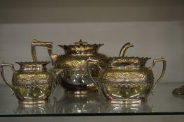 A plated three piece tea service.