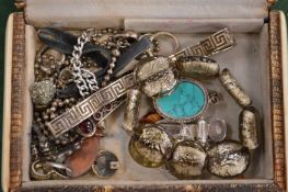 A jewellery box containing jewellery.