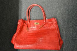A ladies' red handbag.