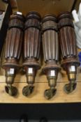 A set of four Victorian mahogany table legs, with heavy brass castors.