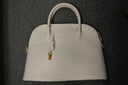 A ladies' white leather handbag.