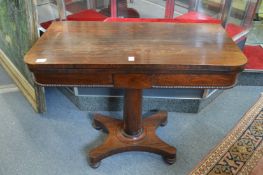 A 19th century rosewood foldover card table.