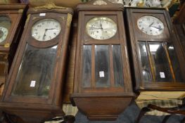Three various oak cased drop dial wall clocks.