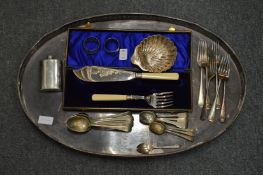 A silver shell shaped dish and a quantity of plated items.