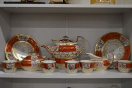 A 19th century part tea service, possibly Chamberlains, gilt and floral decoration with orange