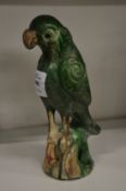 A pottery model of a parrot.